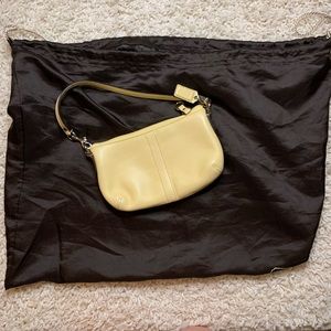 Coach light yellow wristlet